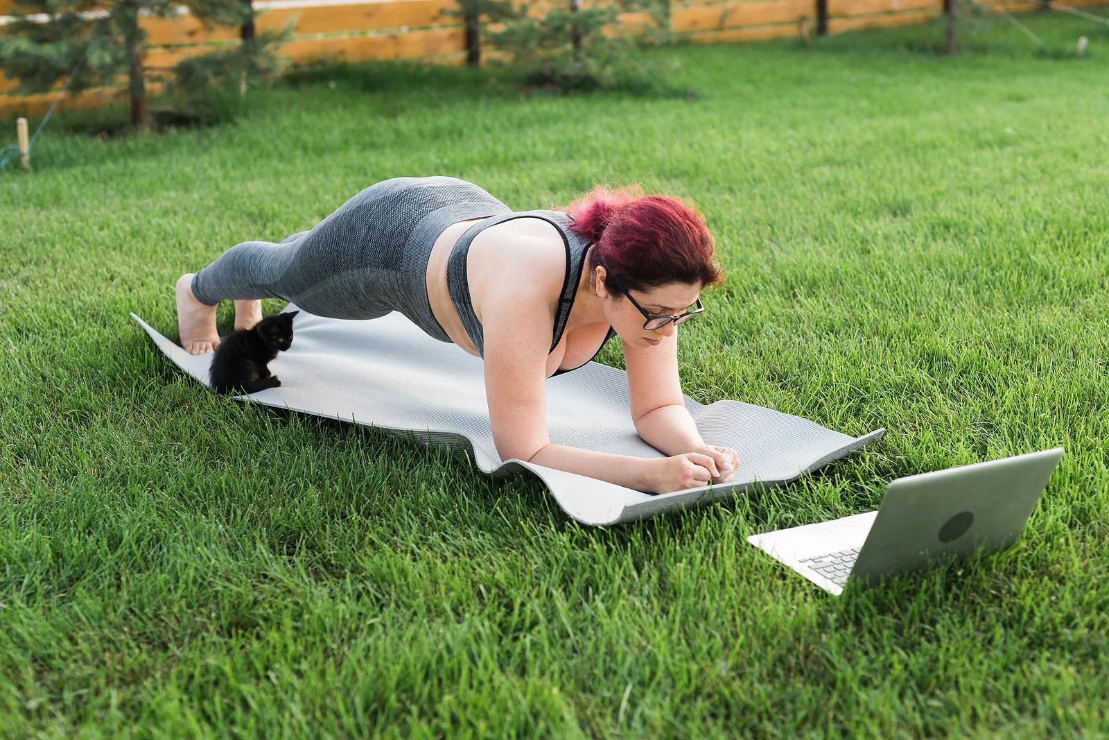  Woman with a kitten doing online yoga therapy in Texas or online yoga therapy in Utah on her laptop in the grass. You can get help for binge eating therapy Austin, TX and beyond here. Read more about Austin eating disorder treatment now. 78701 | 78702 |&nbsp;78732 