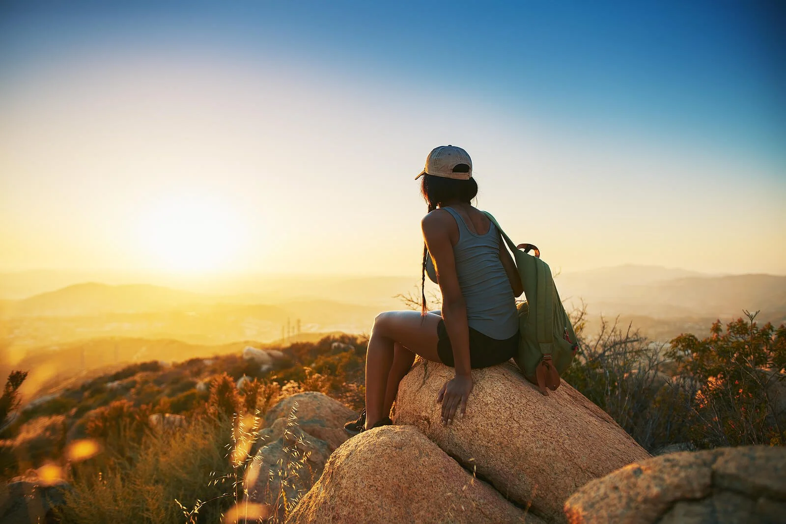 Image of a woman sitting on a rock. Are you wanting to start online therapy in Utah to help you connect with yourself? Working with an online therapist in Utah can help you grow and be healthy. In order to learn more about anxiety therapy online in Utah keep reading. Call today! 84060 | 84020